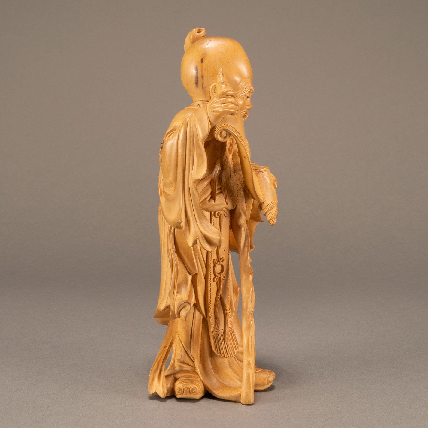 Wooden sculpture of an elderly man