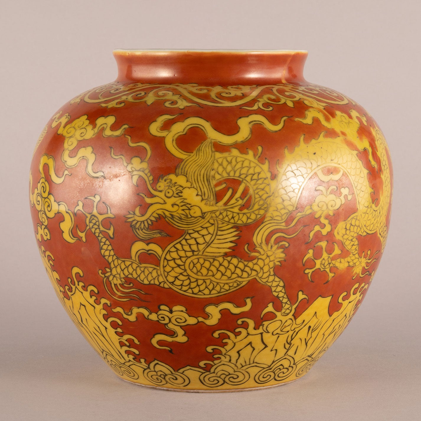 Red background with yellow dragon pattern can