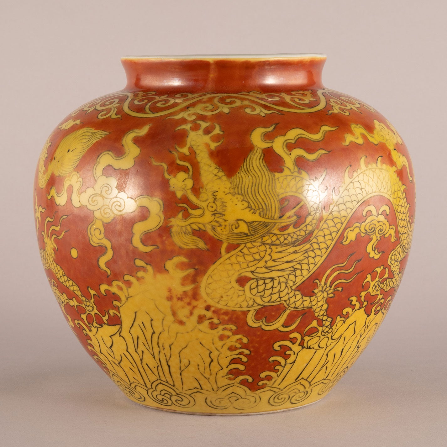 Red background with yellow dragon pattern can