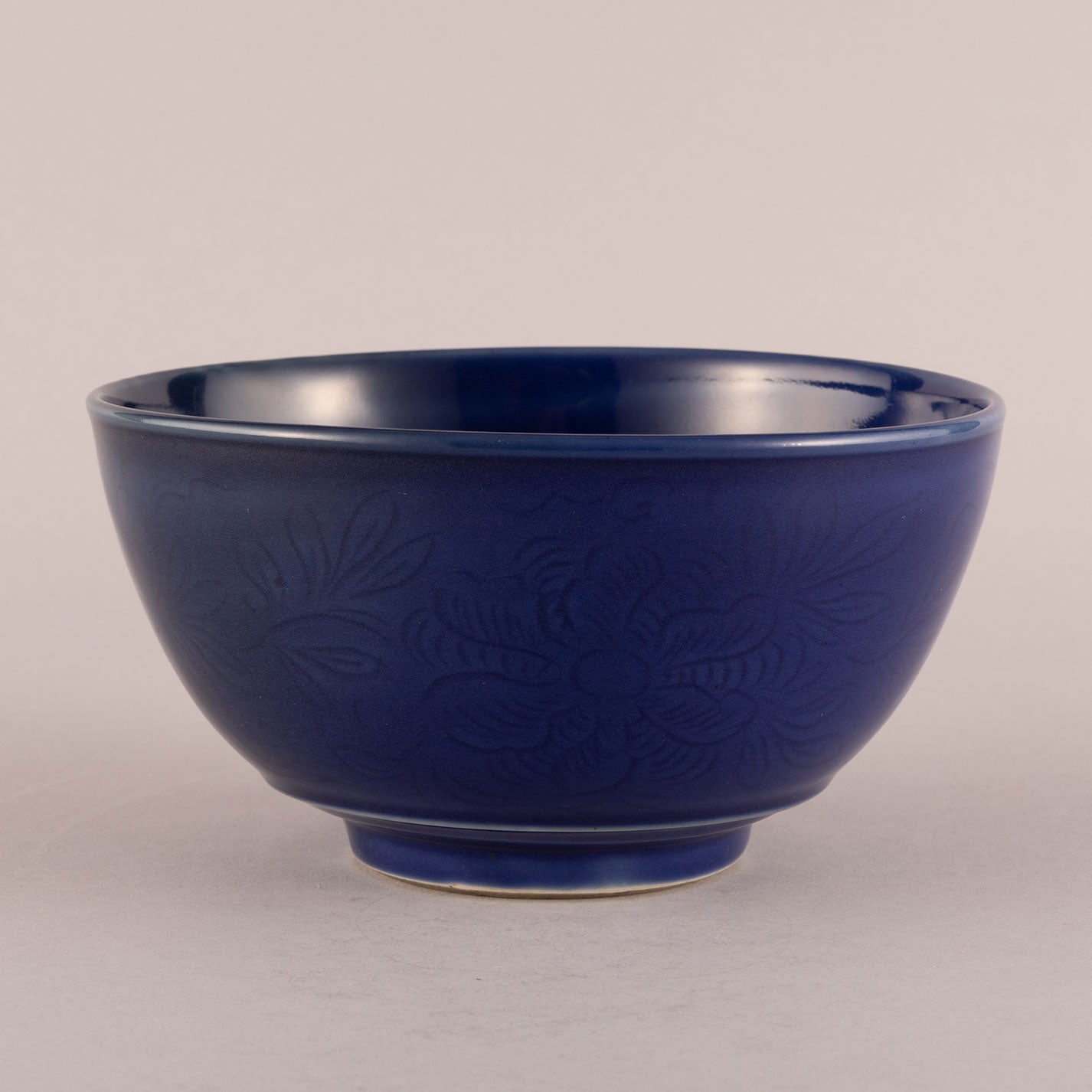 Blue glaze bowl with engraved floral motif