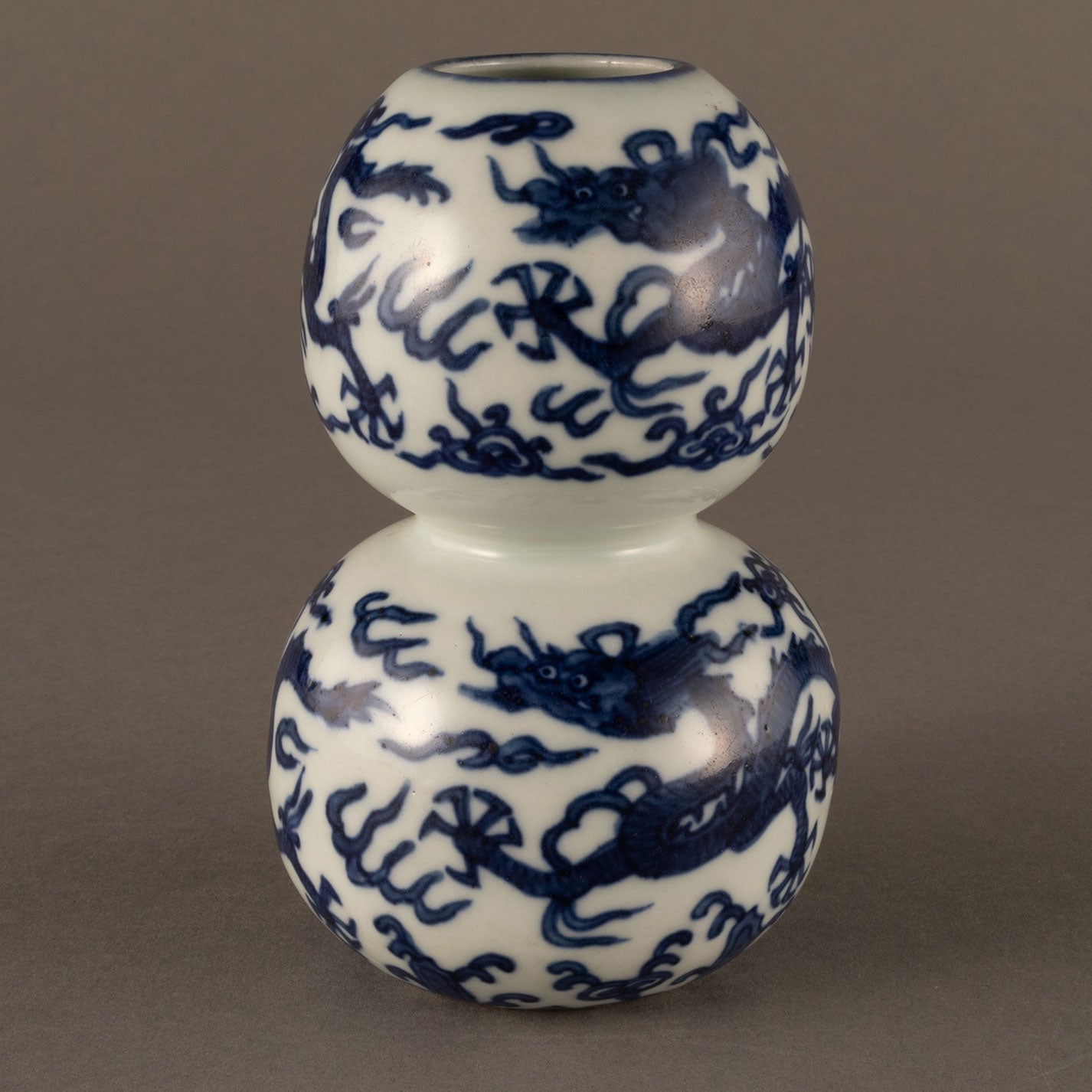 Blue and white cloud and dragon motif holly vase