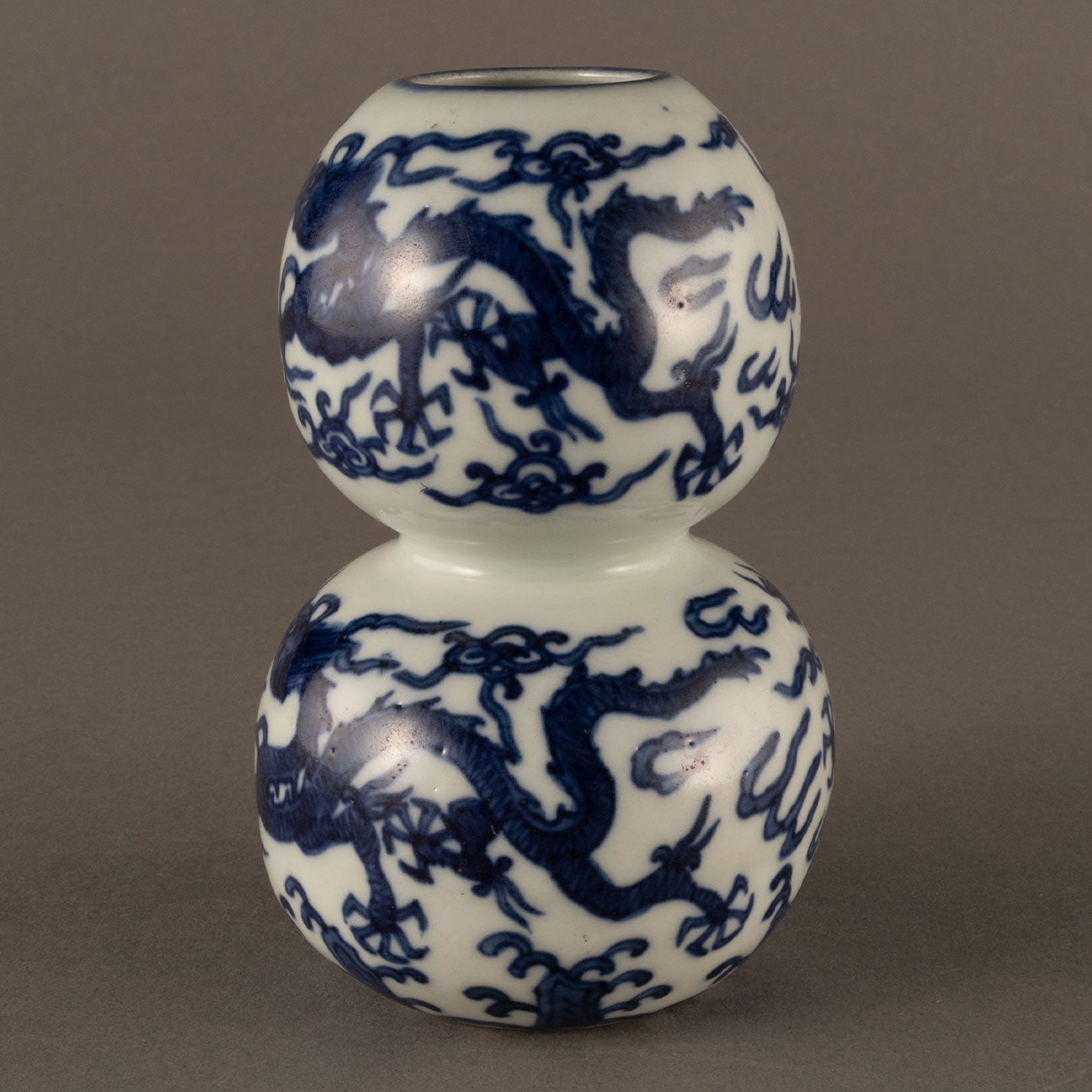 Blue and white cloud and dragon motif holly vase