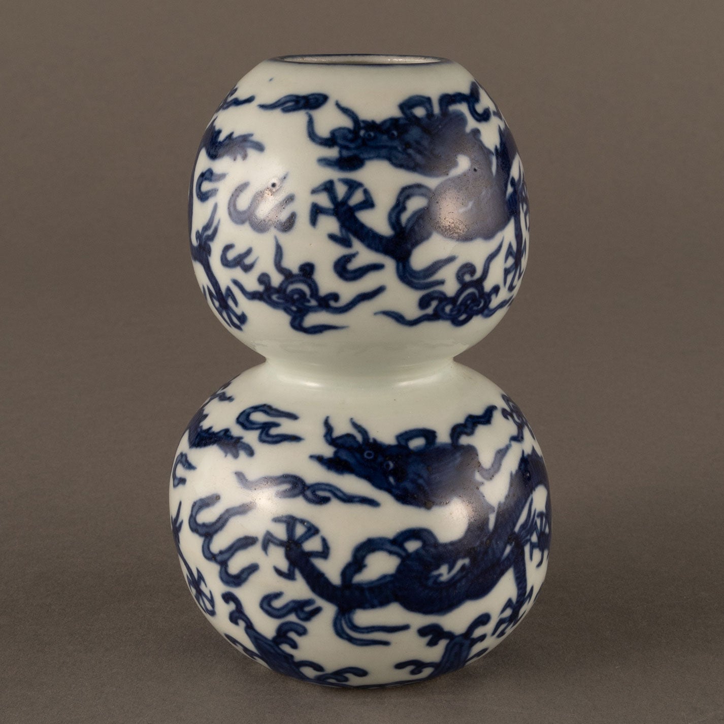 Blue and white cloud and dragon motif holly vase