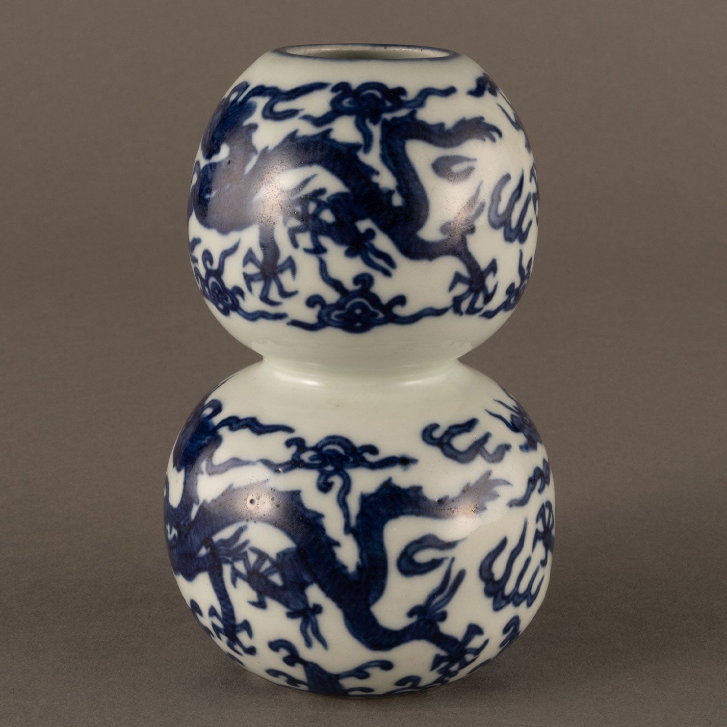 Blue and white cloud and dragon motif holly vase